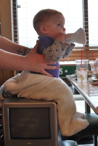 I think the next time we go to lunch, we will remember to bring a belt to help hold Penelope on her booster seat.  We were the envy of other parents at the restaurant today!